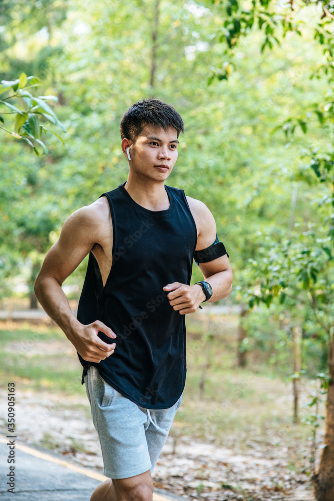Men and women exercise by running on the road. Men and women exercise by running on the road.