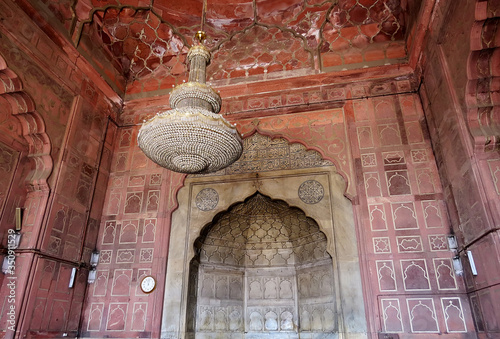 The interior of the Cathedral Mosque Jama Masjit - is a rear wall, a marble niche and a chandelier in the central part. Delhi, India.
