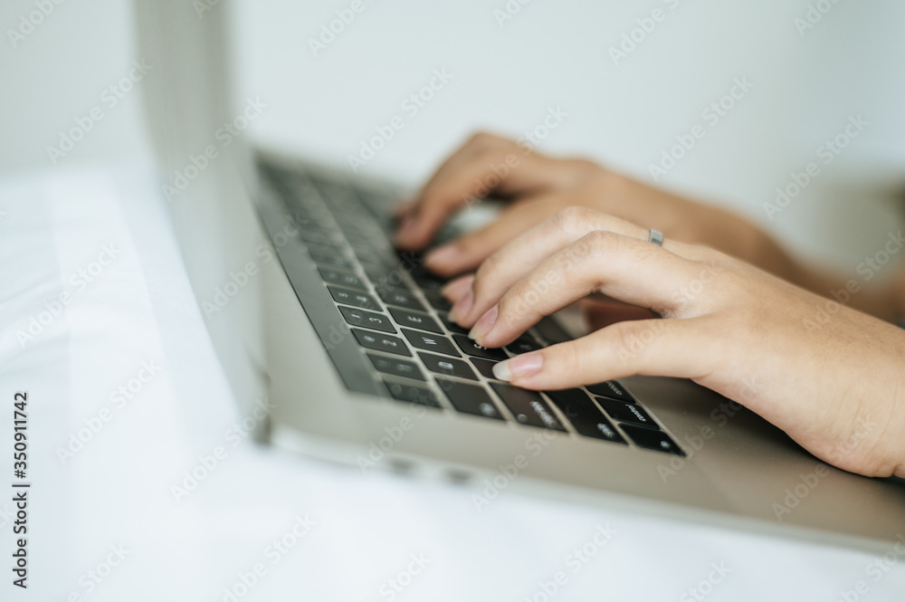 The hand that is put on the laptop. The hand that is put on the laptop.
