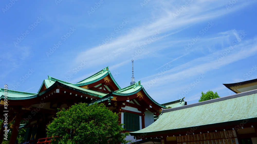 Kameido Tenjin Shrine. Tokyo Skytree towers behind the shrine, adding a sleek modern element Kameido Tenjin Shrine. Tokyo Skytree towers behind the shrine, adding a sleek modern element