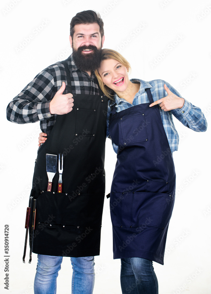 The last details. Family weekend. Couple in love hold kitchen utensils. Man bearded hipster and girl. Preparation and culinary. Tools for roasting meat. Picnic barbecue. food cooking recipe The last details. Family weekend. Couple in love hold kitchen utensils. Man bearded hipster and girl. Preparation and culinary. Tools for roasting meat. Picnic barbecue. food cooking recipe
