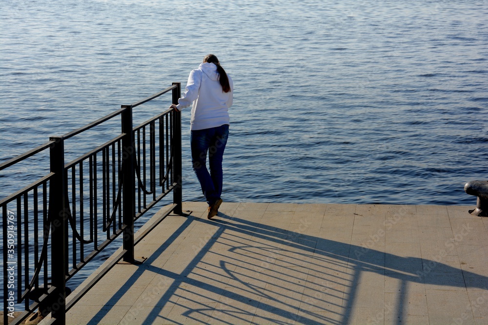 young woman standing on pier