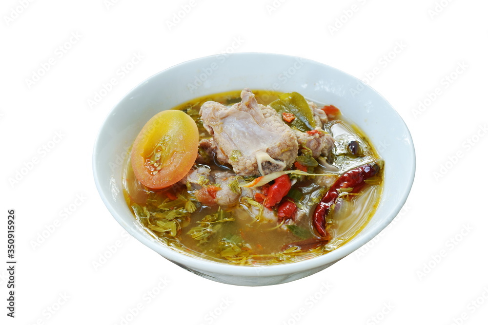 hot and spicy pork bone with tamarind leaf and Thai herbs soup on bowl hot and spicy pork bone with tamarind leaf and Thai herbs soup on bowl