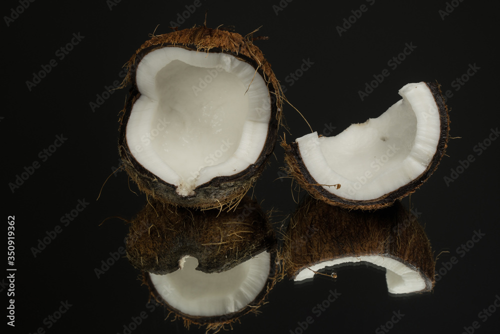 Coconut on a black background. Dark background Coconut on a black background. Dark background