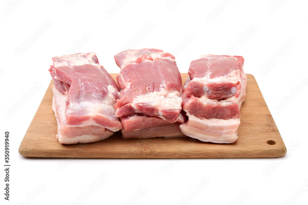 Raw pork belly pieces on a white background Raw pork belly pieces on a white background