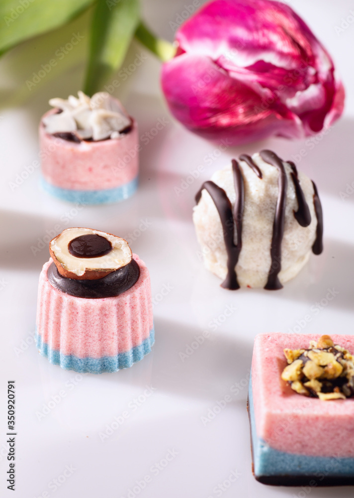 Chocolate candies without sugar on the white background. Raw vegan