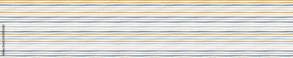 
Seamless french farmhouse stripe pattern. Provence blue linen shabby chic style. Hand drawn texture. Yellow blue background. Doodle line wallpaper home decor swatch. Modern textile all over print