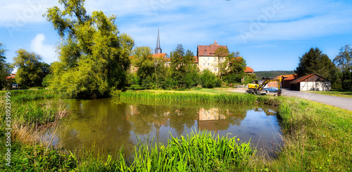 View to the Hinterburg with pond in Schlitz, Hesse, Germany