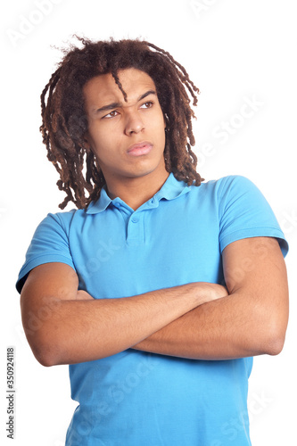 Thoughtful African American young man with crossed arms