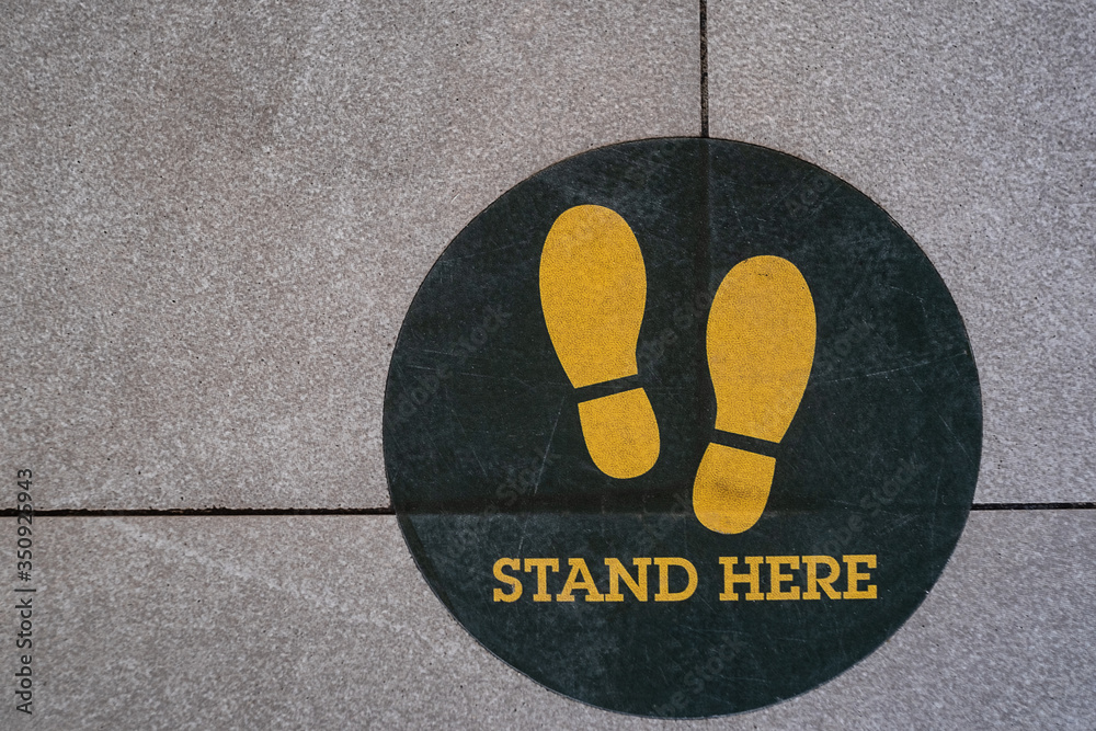 Stand here foot sign or symbol on the floor,Top view style Stock Photo ...