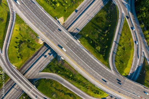 Highway and overpass in city, aerial view