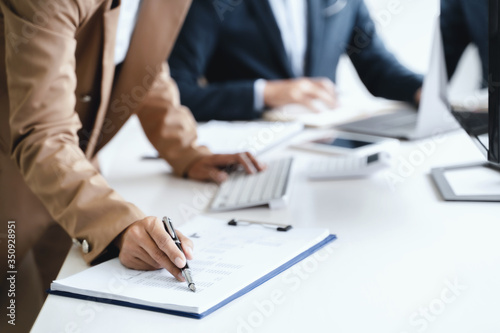 Business sales consultant discussing in data documents at modern office.