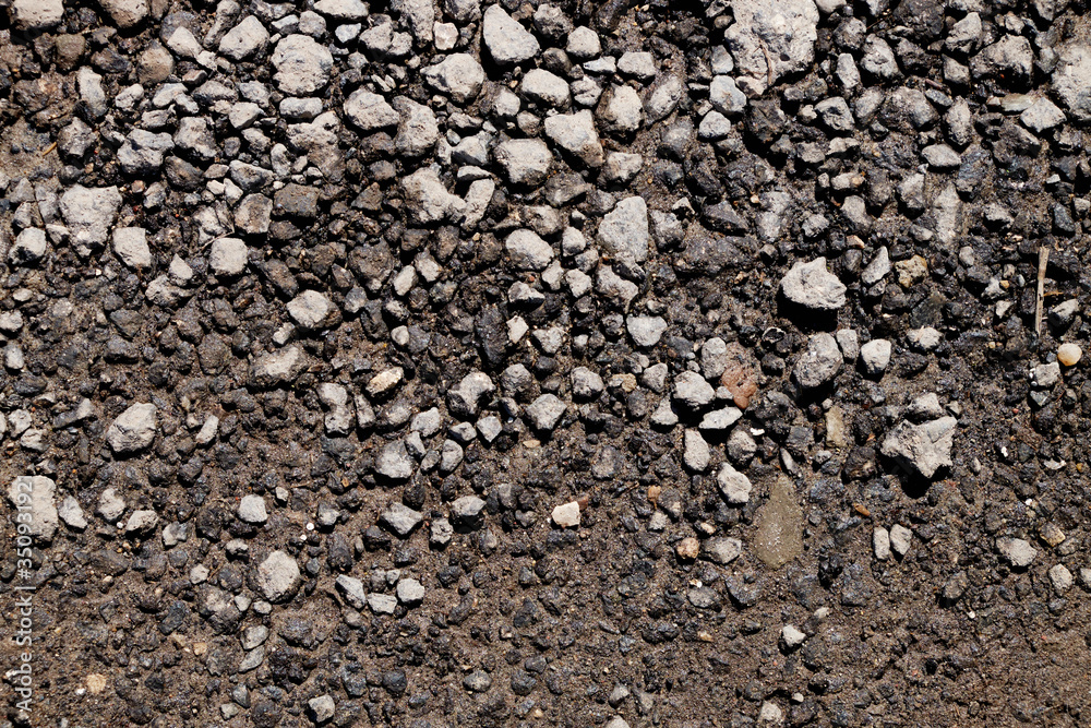 The texture of the broken road. Old building blocks. Background for screensaver monitor The texture of the broken road. Old building blocks. Background for screensaver monitor