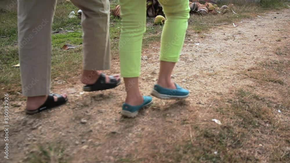 Women's Feet Walking On The Rough Trail In The Philippines - closeup shot Women's Feet Walking On The Rough Trail In The Philippines - closeup shot