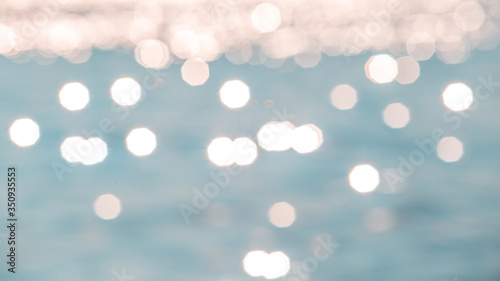 Abstract or blurry image of glitter water of sea or ocean for background usage.