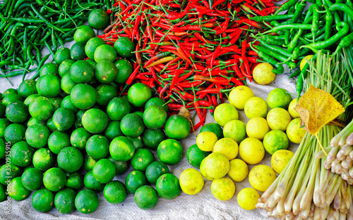 Asian market selling fresh fruit and vegetables in Vietnam reflex