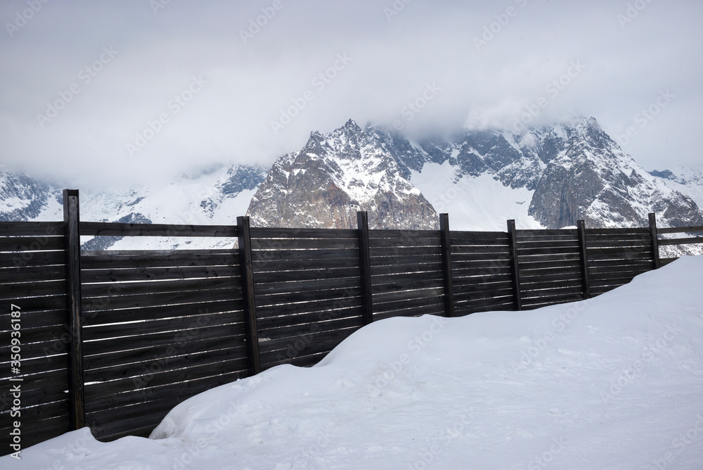 Fence at ski resort, Alpine Resort, Aosta Valley, Courmayeur, Northern Italy, Italy Fence at ski resort, Alpine Resort, Aosta Valley, Courmayeur, Northern Italy, Italy