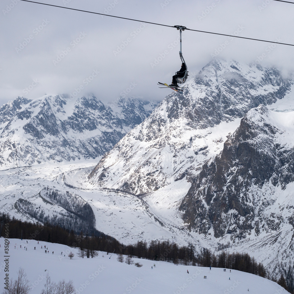 Chair lift over ski resort, Alpine Resort, Aosta Valley, Courmayeur, Northern Italy, Italy