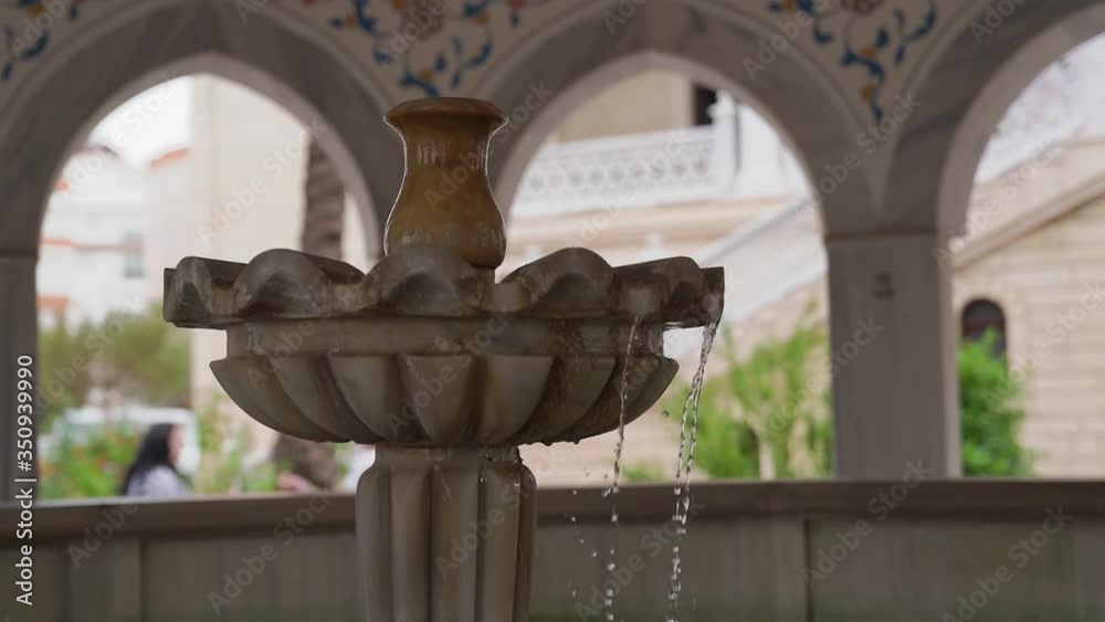 A beautiful fountain in the shape of a flower with flowing water. A beautiful fountain in the shape of a flower with flowing water.