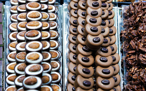 Fototapeta Naklejka Na Ścianę i Meble -  Selection of Swiss chocolate sweets with almond reflex