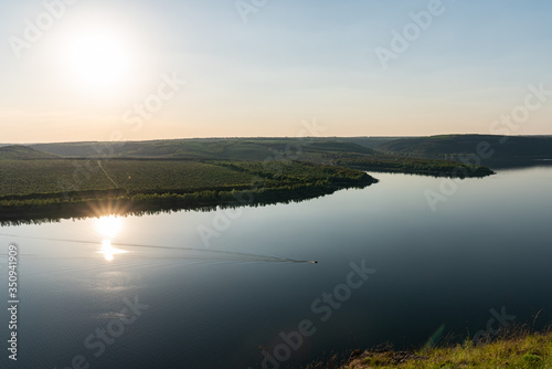 Sunset river boat silhouette view. River boat sunset landscape