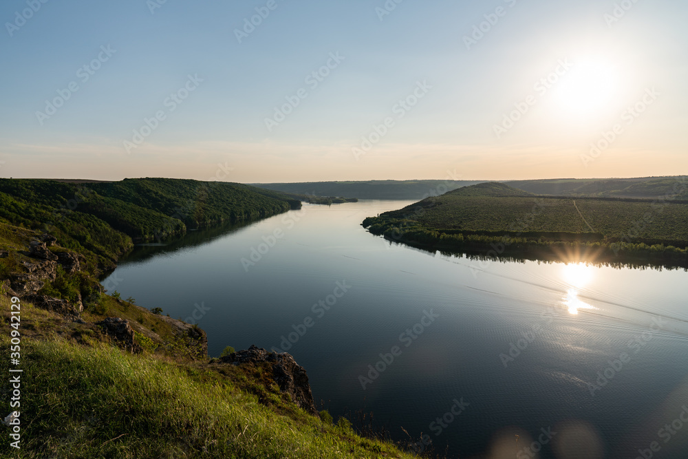 Sunset river clear sky landscape. Summer rural river view with sunset panorama