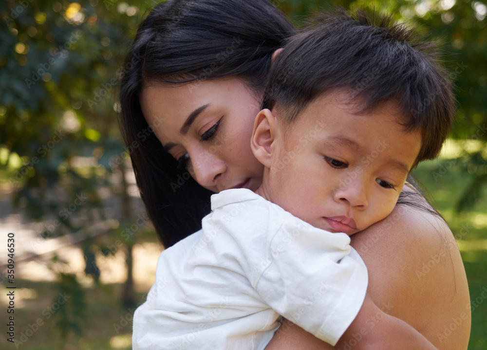 Sad son hugging his mother. Parenthood, Concept of couple family. Sad son hugging his mother. Parenthood, Concept of couple family.