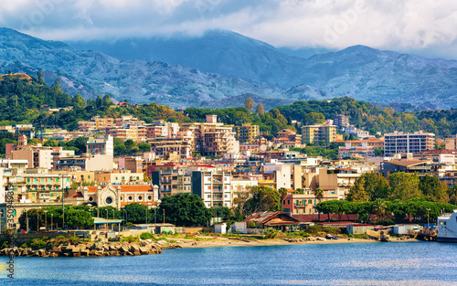 Cityscape of Messina and Mediterranean Sea at Sicily island reflex