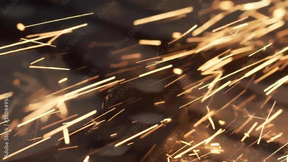Slow motion sparks from metal grinding machine. Industrial concept grinding metal with sparks. Metal milling machine during grinding out the metal detail in factory. Metal grinding machine with sparks
