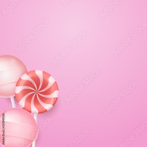 Pink background with yummy lollipops and candies. Candy background.