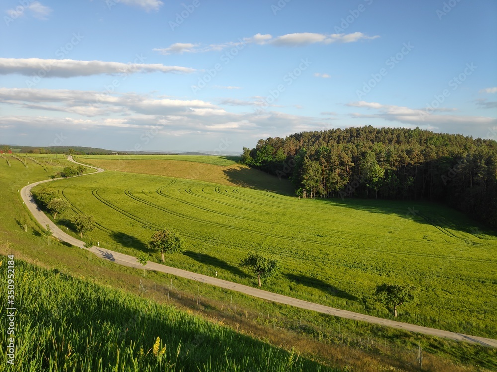 Fototapeta premium A beautiful evening in Franconia, Bavaria, in Germany as the sun goesdown