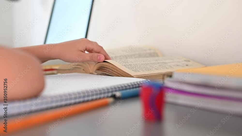Stress kid doing homework.Boy at study table doing homework with stress action.Lazy boy doing homework with stressed face. Stress kid doing homework.Boy at study table doing homework with stress action.Lazy boy doing homework with stressed face.