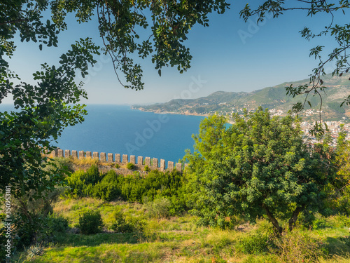 Alanya, Turkey. Beautiful view from the fortress Alanya Castle of the Mediterranean Sea and Cleopatra beach at sunset. Vacation postcard background photo