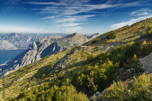 Sunrise panoramic morning view of mountain randge and Kotor bay  Montenegro. View from the top of the mountain serpentine.