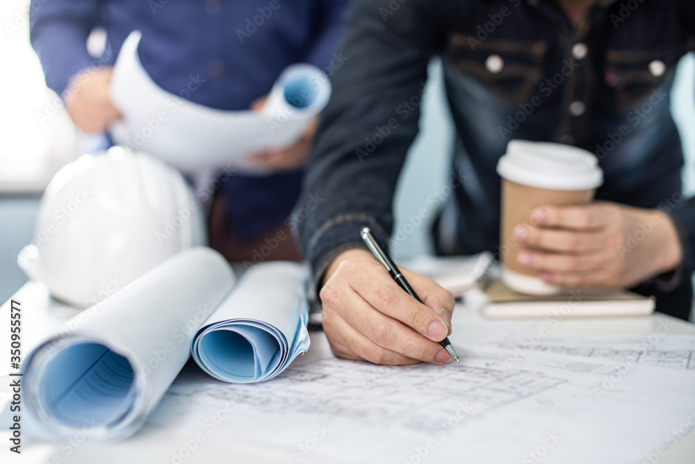 Architect working on blueprint. Architects workplace - architectural ...