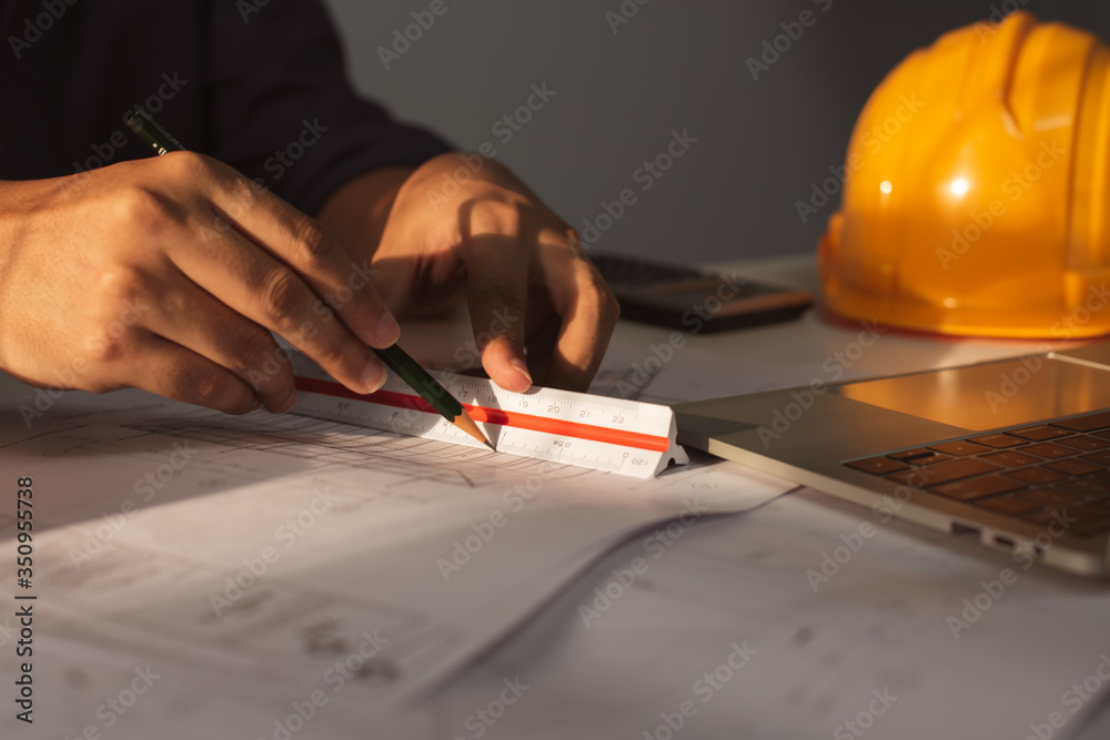 Architect working on blueprint. Architects workplace - architectural ...