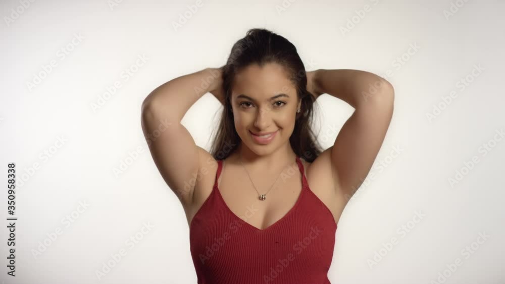 Young Woman Flicks Hair Back Young Woman Flicks Hair Back