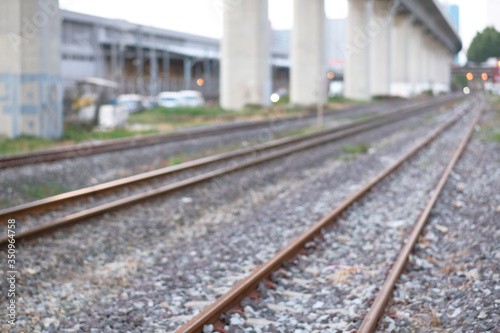 The close-up of Iron rails for the railway on gravel stones