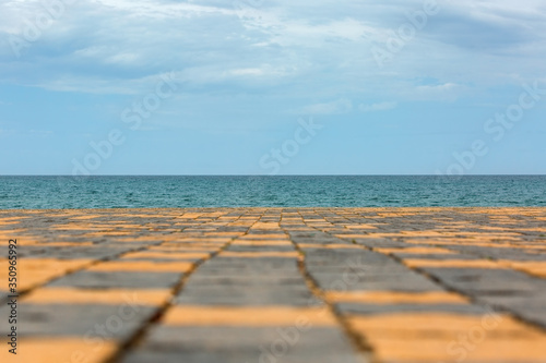 square tile platform on the background of the sea