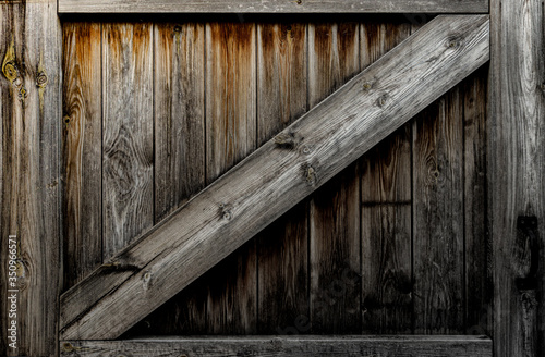 Old wooden gate with rustic wooden planks