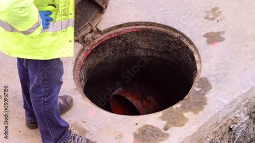 construction  worker cleaning and repairing pipes inside the sewer , video hd footage