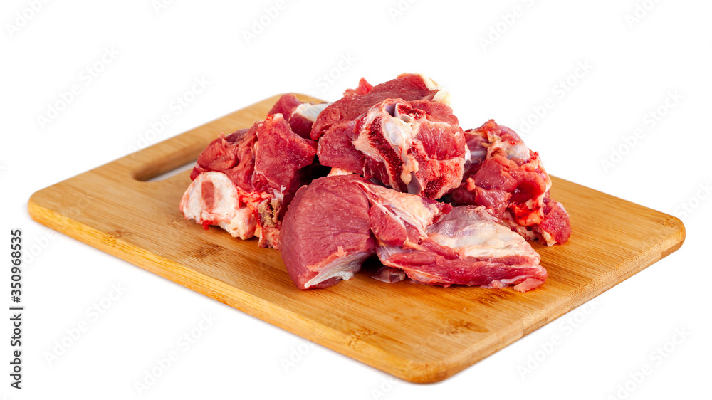 Chopped raw meat on wooden board isolated on white background