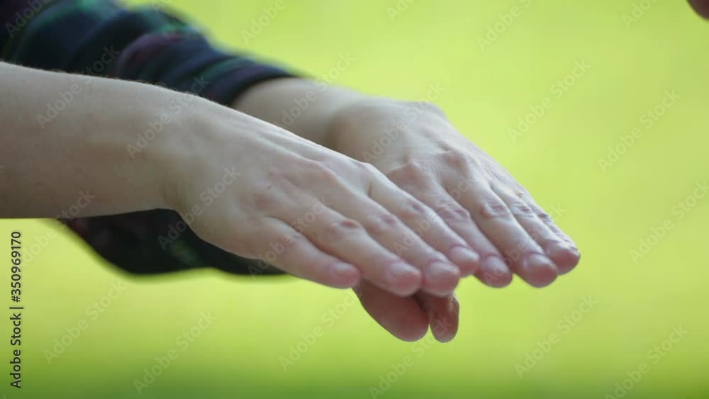 Spraying female hands with an antiseptic. Hand disinfection with an antibacterial septic tank. Spraying female hands with an antiseptic. Hand disinfection with an antibacterial septic tank.