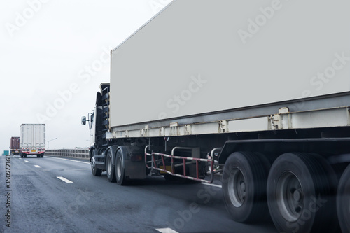 Truck on highway road with white container, transportation concept.,import,export logistic industrial Transporting Land transport on asphalt expressway