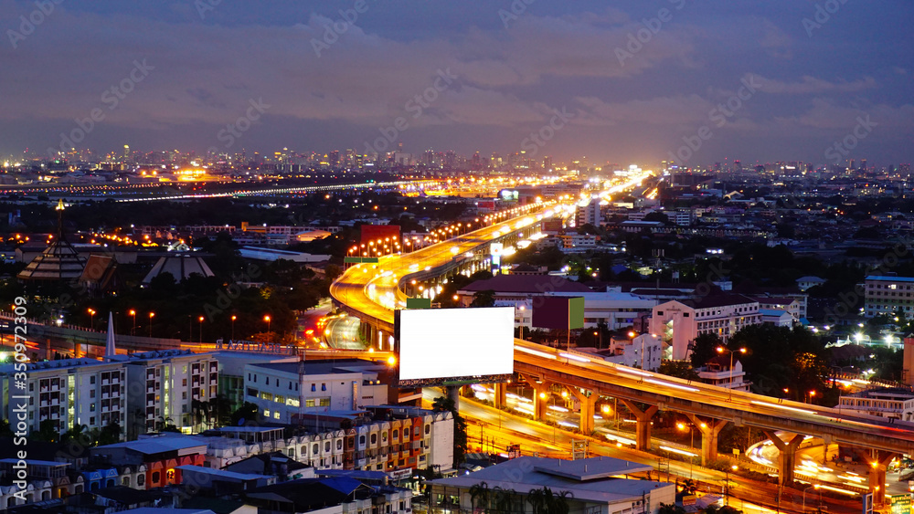 
High Angle View Of Illuminated Buildings In City At Night 