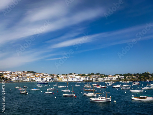 Boats in the bay with blue sky and clouds