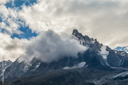 French Alps mountains in a cloudy summer day  seen from Chamonix  Haute Savoy  France.