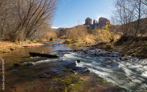 Sedona's iconic Oak Creek flowing peacefully in the morning light, Cathedral Rock in the background. Crescent Moon Ranch, Sedona Arizona. 