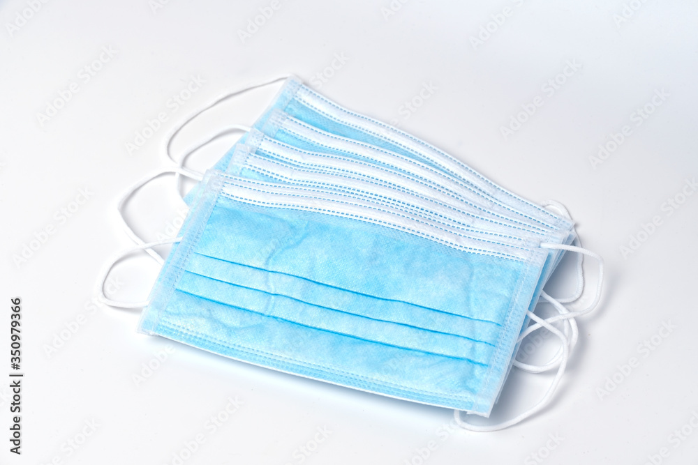 Protective face mask on a white background to protect and prevent the spread of the virus, flu, and pollution. Cover mouth and nose with a mask. Protective face mask on a white background to protect and prevent the spread of the virus, flu, and pollution. Cover mouth and nose with a mask.