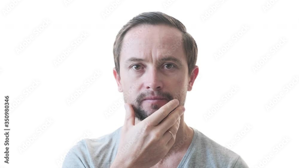 Young man with beard isolated on the pure white background. Portrait of the young adult male with beard Young man with beard isolated on the pure white background. Portrait of the young adult male with beard